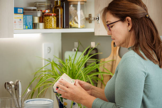 Woman checking for toxic ingredients in product