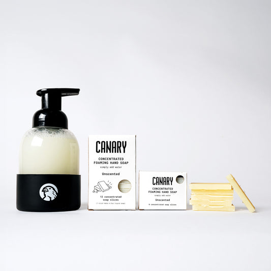 Image of Unscented Foaming Hand Soap. 1 box containing 12 soap slices and 1 box containing 6 soap slices. Sustainable refillable glass bottle filled with soap and 6 soap slices next to product.