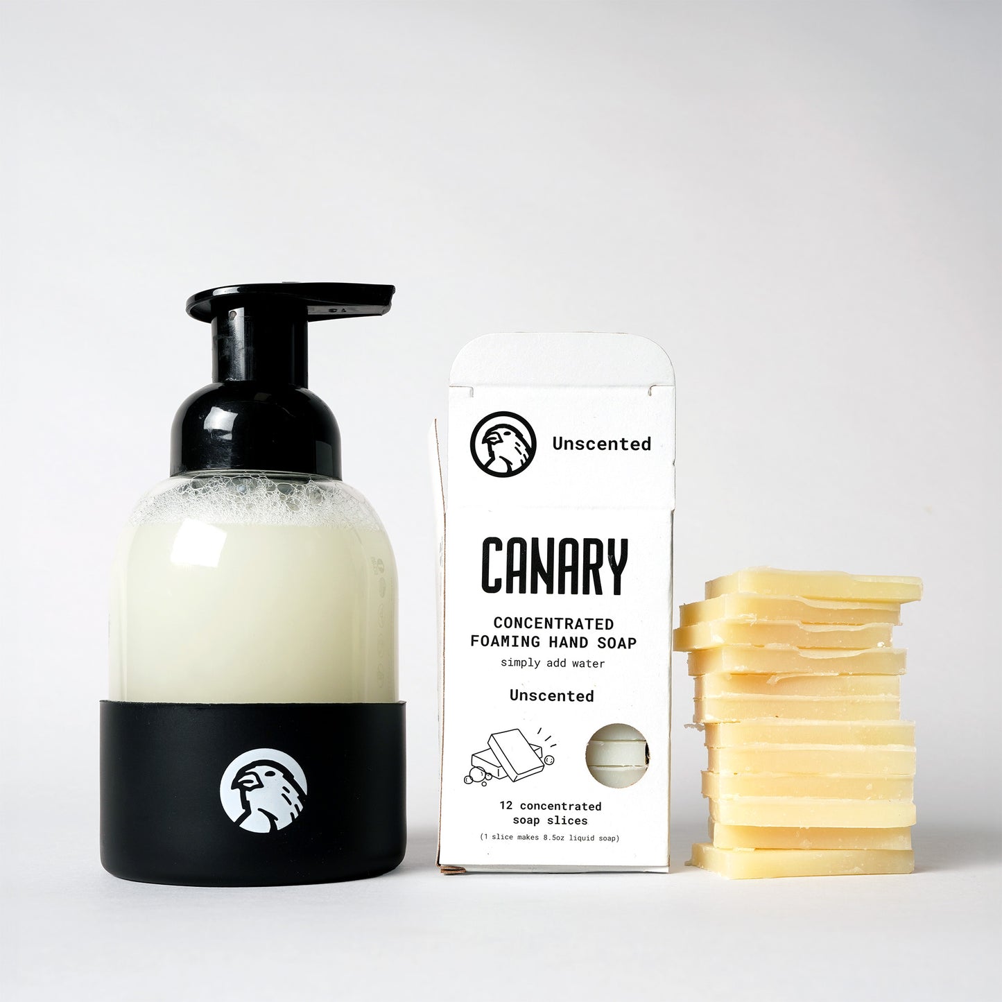 Image of Unscented Foaming Hand Soap. 12 soap slices. Sustainable refillable glass bottle filled with soap and 12 soap slices next to product.