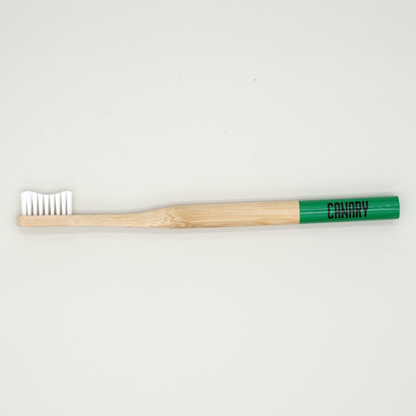 Canary Bamboo Toothbrush with green tip