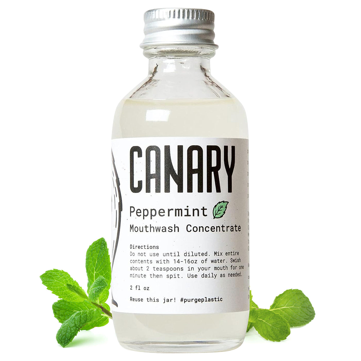 Canary Peppermint Mouthwash Concentrate 2 ounce bottle. Mint leaves around bottle with directions on how to use.