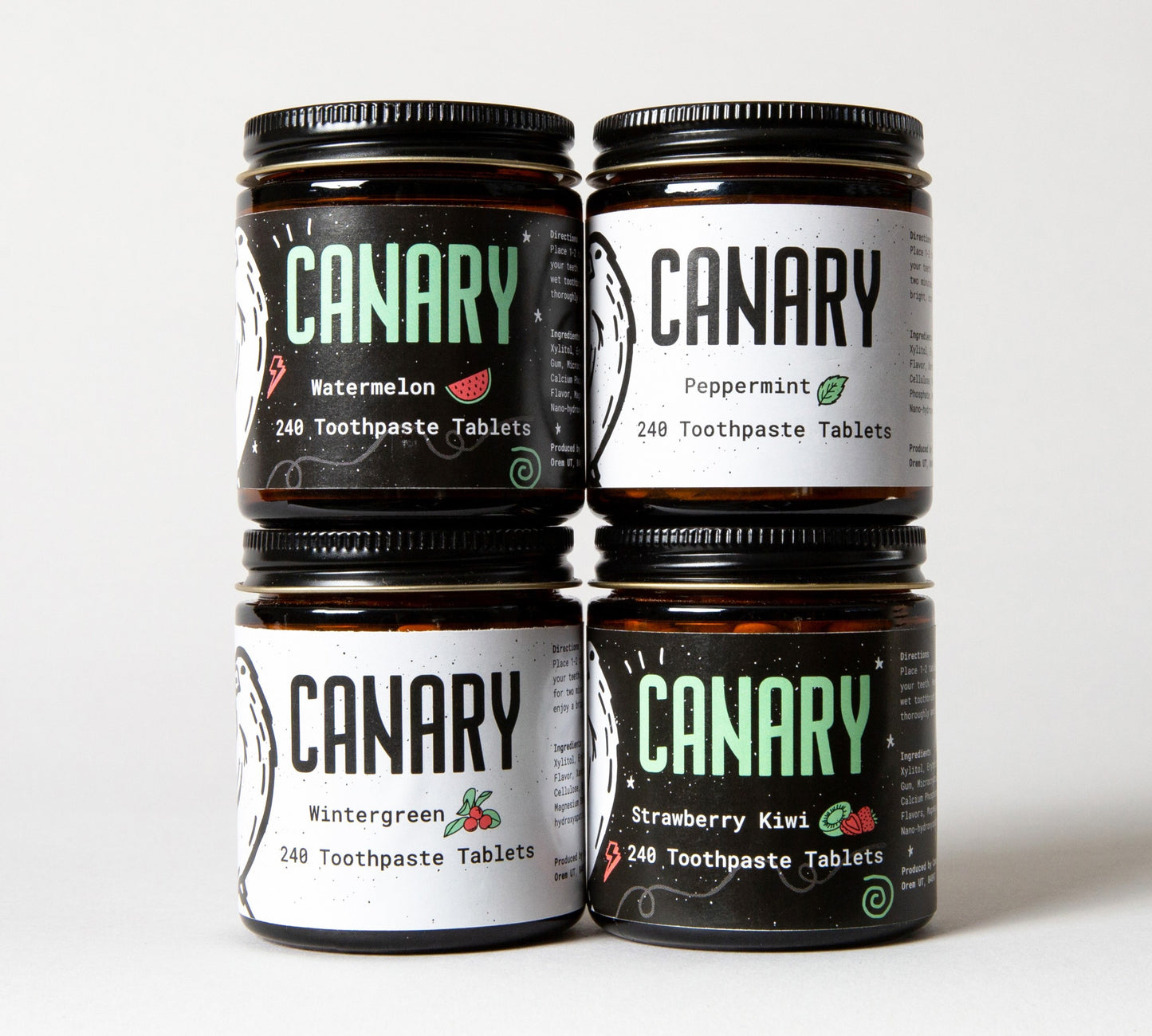 Canary Toothpaste Tablets Stack 4 jars. Watermelon, Peppermint, Wintergreen, and Strawberry Kiwi Flavored.