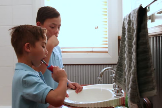 Kids brushing teeth before school with Canary Toothpaste Tablets