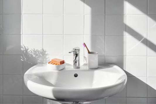 Plastic free bathroom with bamboo toothbrush and bar soap. Add in our toothpaste tablets for plastic free oral care.