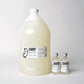 One Gallon of bulk concentrated Peppermint Flavored Mouthwash, for wholesale, retail and refill shops. Shown next to two of our 2oz bottles for size reference. 