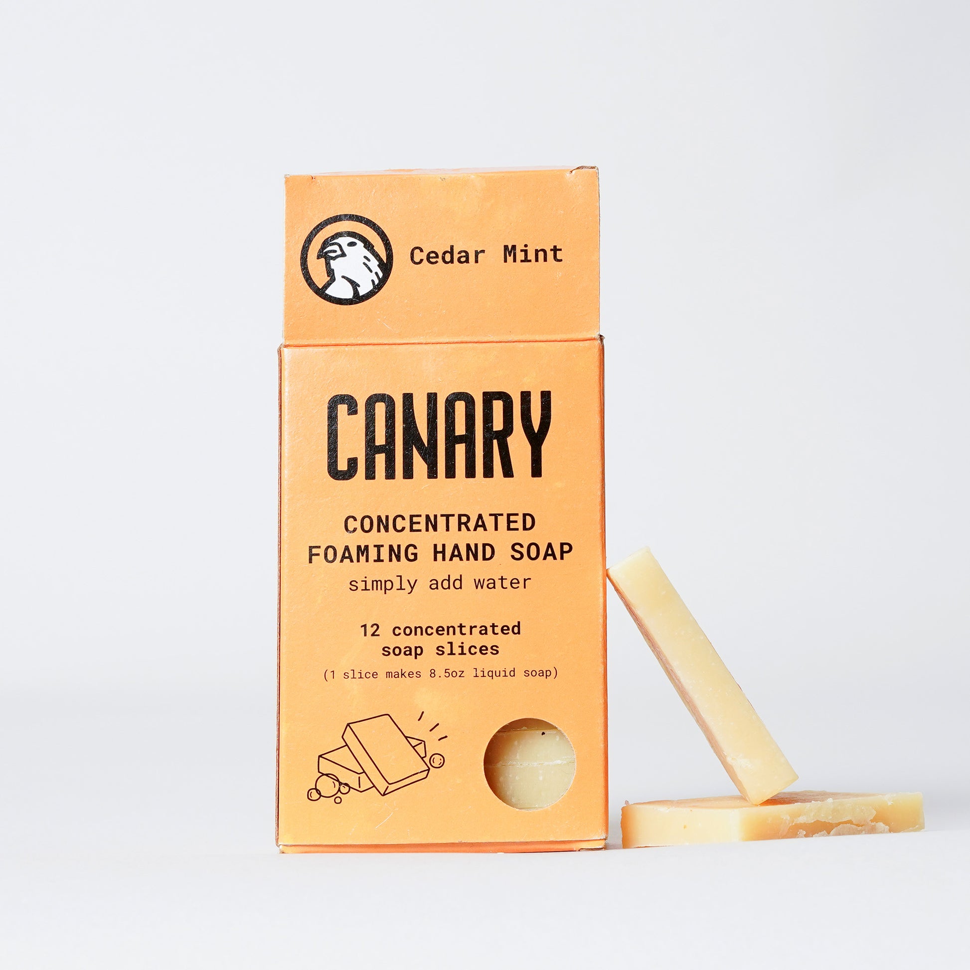 Cedar Mint Concentrated Foaming Hand Soap. Front of the box with 2 slices on the side. 12-count box. 