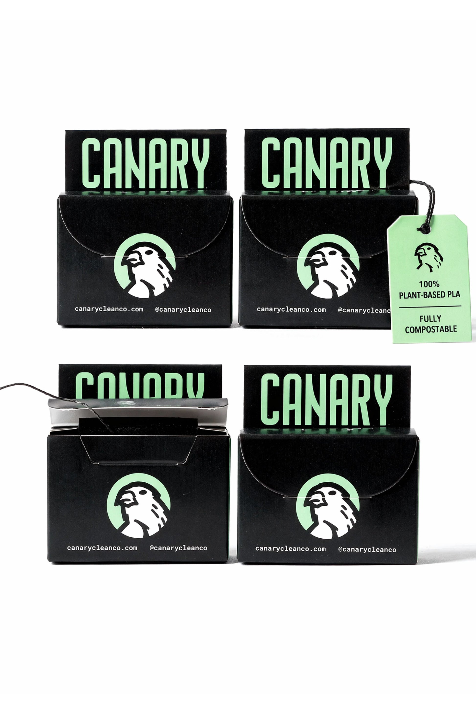 Image of 4 Canary Dental Floss boxes stacked on top of each other