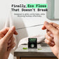 Image of hands pulling on canary dental floss showcasing the durability. With packaging on bathroom sink.