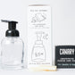 Image of Concentrated Foaming Hand Soap Starter Kit. Info included what is in box. Fire Needle and Sage scent and Refillable Glass bottle next to product. 
