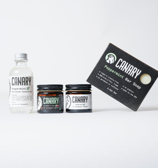 Canary plastic-free sample family pack, consisting of our 2oz bottle of concentrated mouthwash concentrate, 60ct jar of our Strawberry+Kiwi Tablets, 60ct jar of our Peppermint Toothpaste Tablets and our 4.5oz bar of our Peppermint Bar Soap