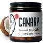 Close Up Image of Canary Coconut Mint Toothpaste tablets jar - 126 count. With a coconut in the background of image.