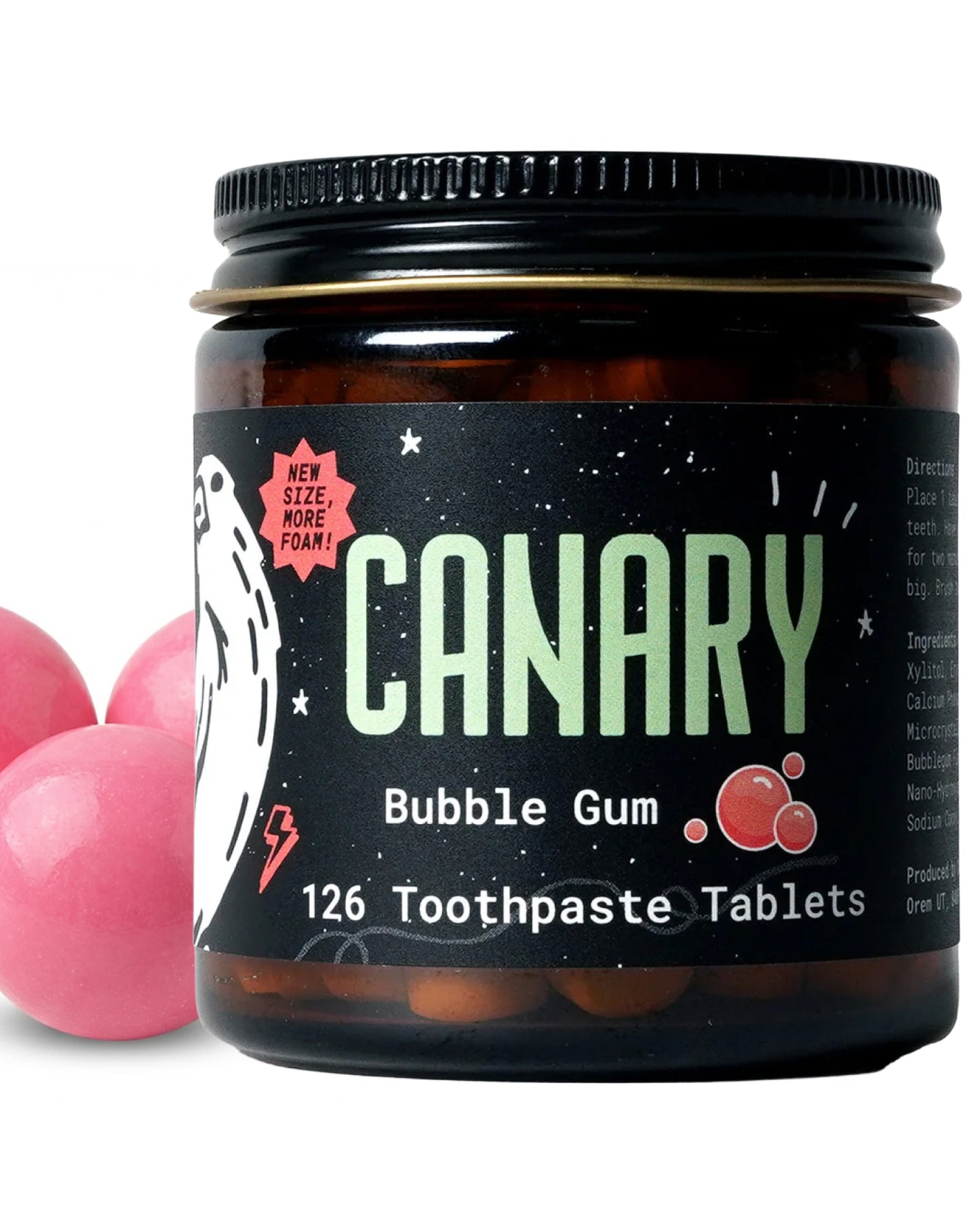 Close Up Image of Canary Bubble Gum Toothpaste tablets jar - 126 count. With pink bubble gum in the background.