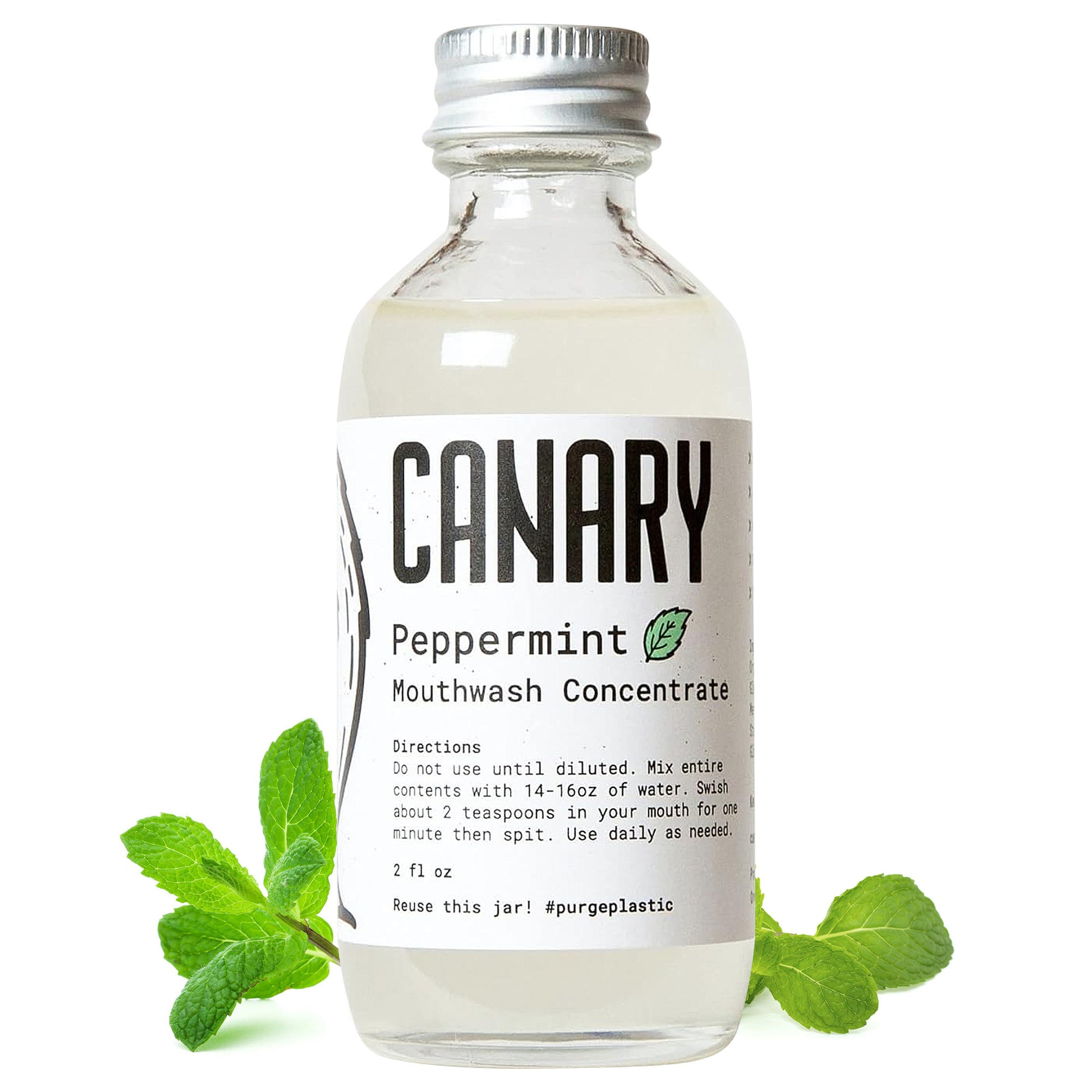 Canary Peppermint Mouthwash Concentrate 2 ounce bottle. Mint leaves around bottle with directions on how to use.