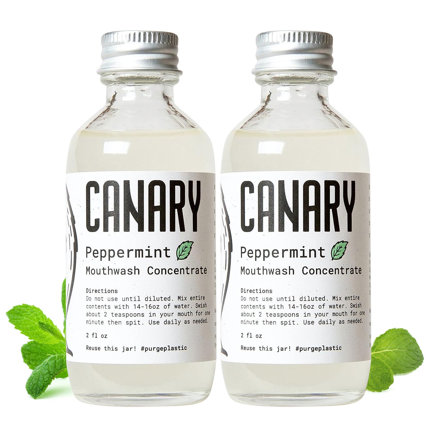 2 Canary Peppermint Mouthwash Concentrate 2 ounce bottle. Mint leaves around bottle with directions on how to use.
