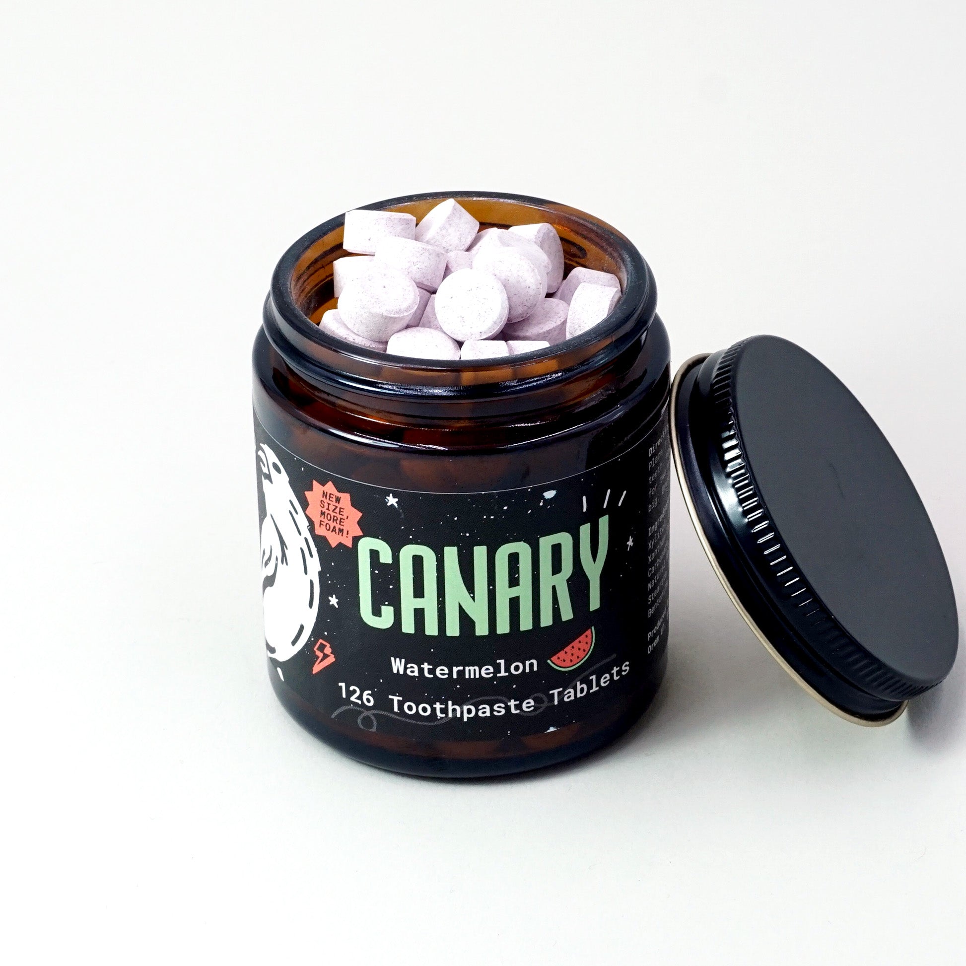 New and Improved Canary Watermelon Toothpaste Tablets, 126 count, two-month supply jar , view of tablets in the opened jar.