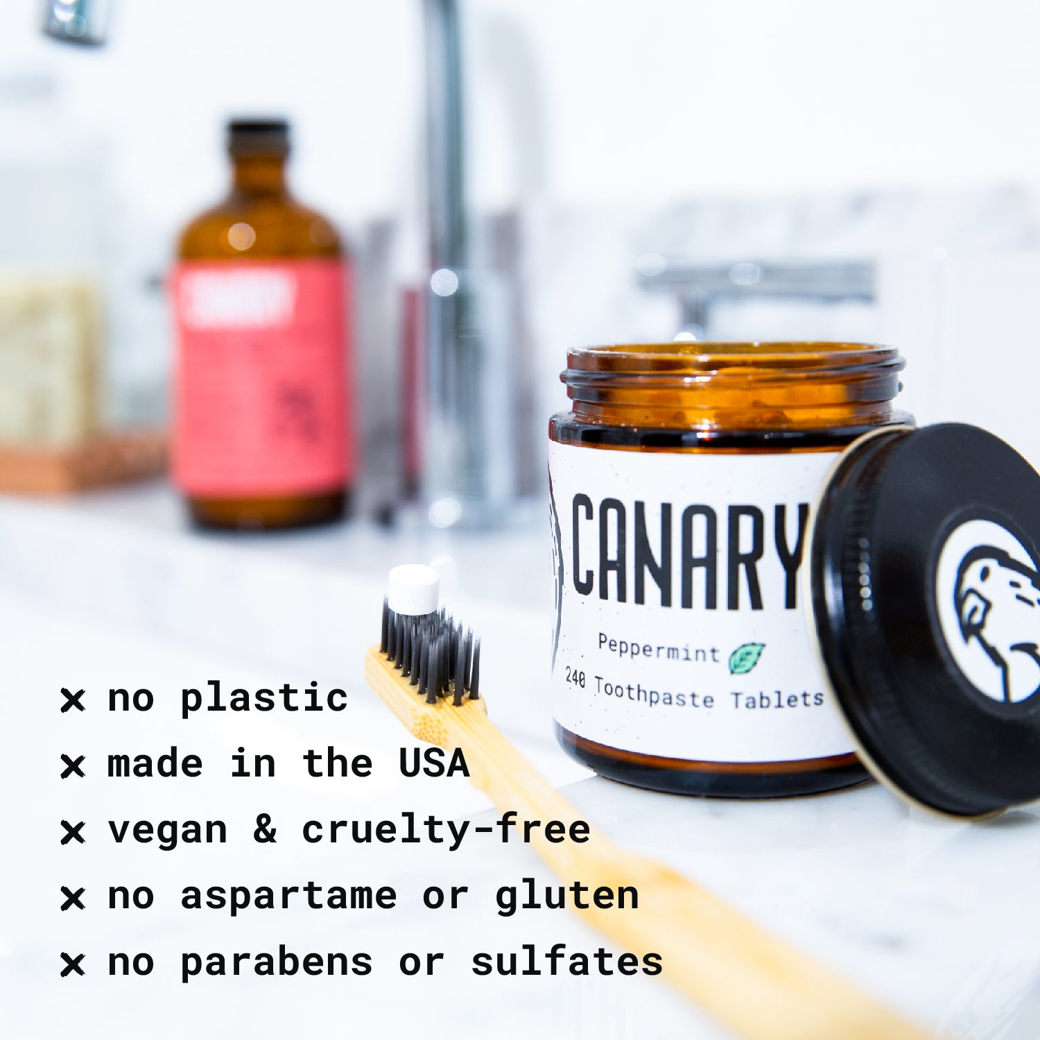 Canary Peppermint Toothpaste Tablets jar on sink with toothbrush, and copy highlighting the benefits